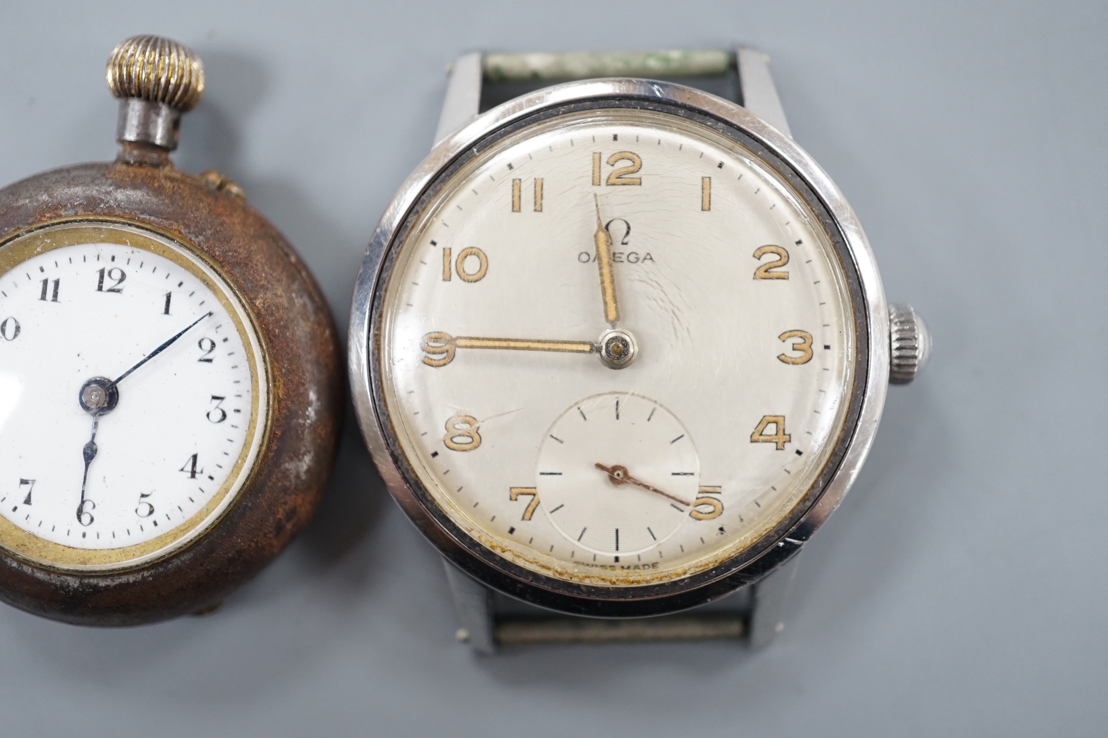 A gentleman's stainless steel Omega manual wind wrist watch, no strap and a fob watch.